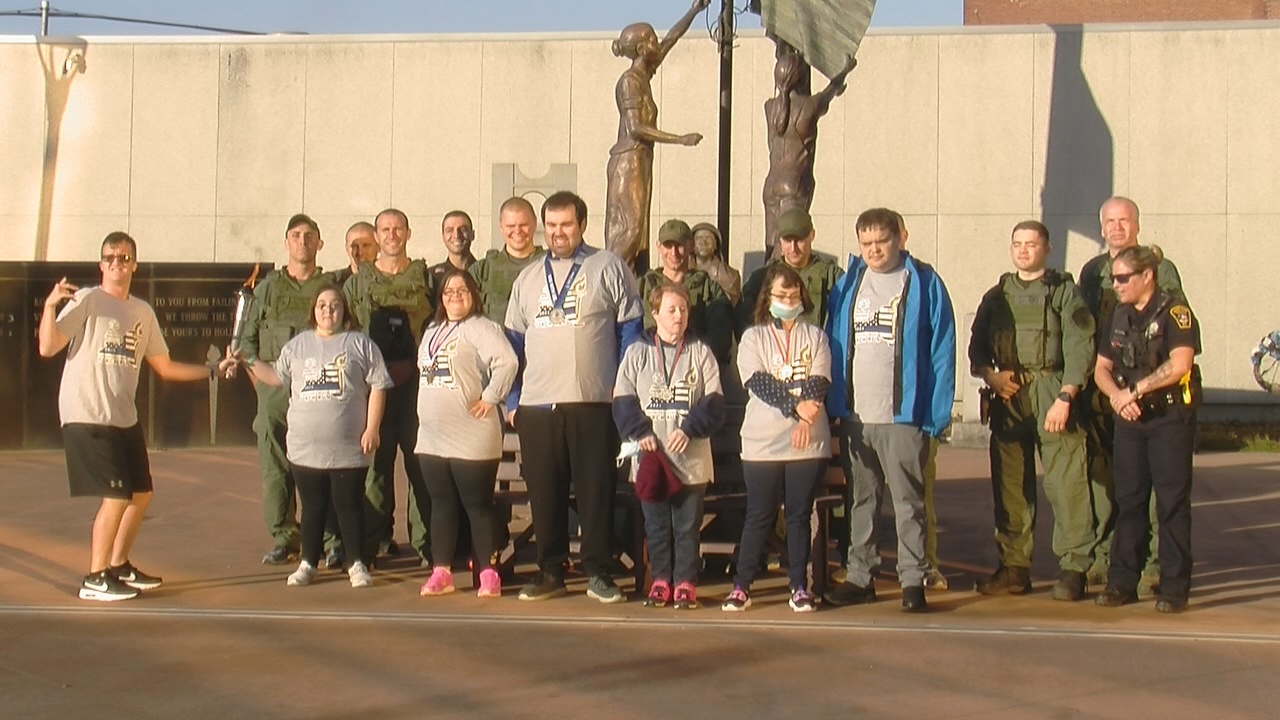 Law Enforcement Runs With The Special Olympic Athletes In Jamestown