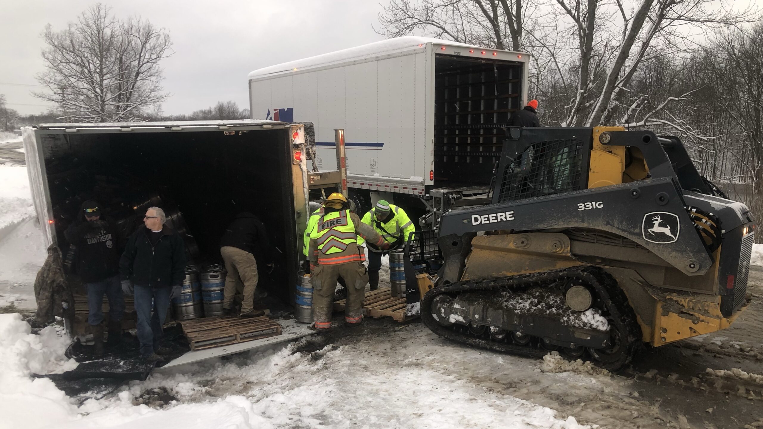 Truck Hauling Booze Overturns Due To Slick Roadways Near Falconer