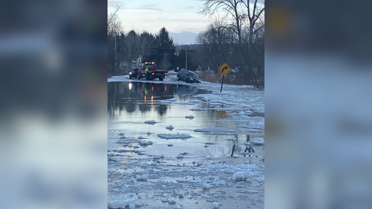 Van Crashes Along Flooded Roadway In Ellicott
