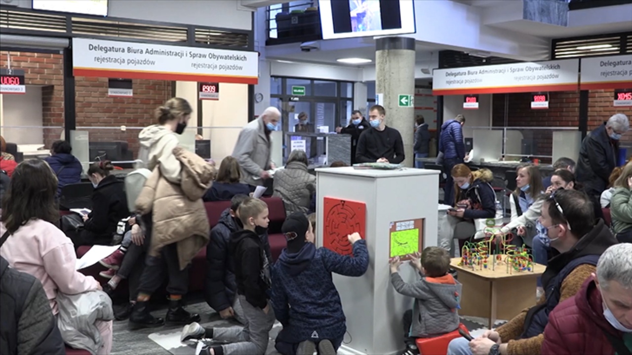 Ukrainian Refugees Wait For Polish ID, Receive Donations From Locals