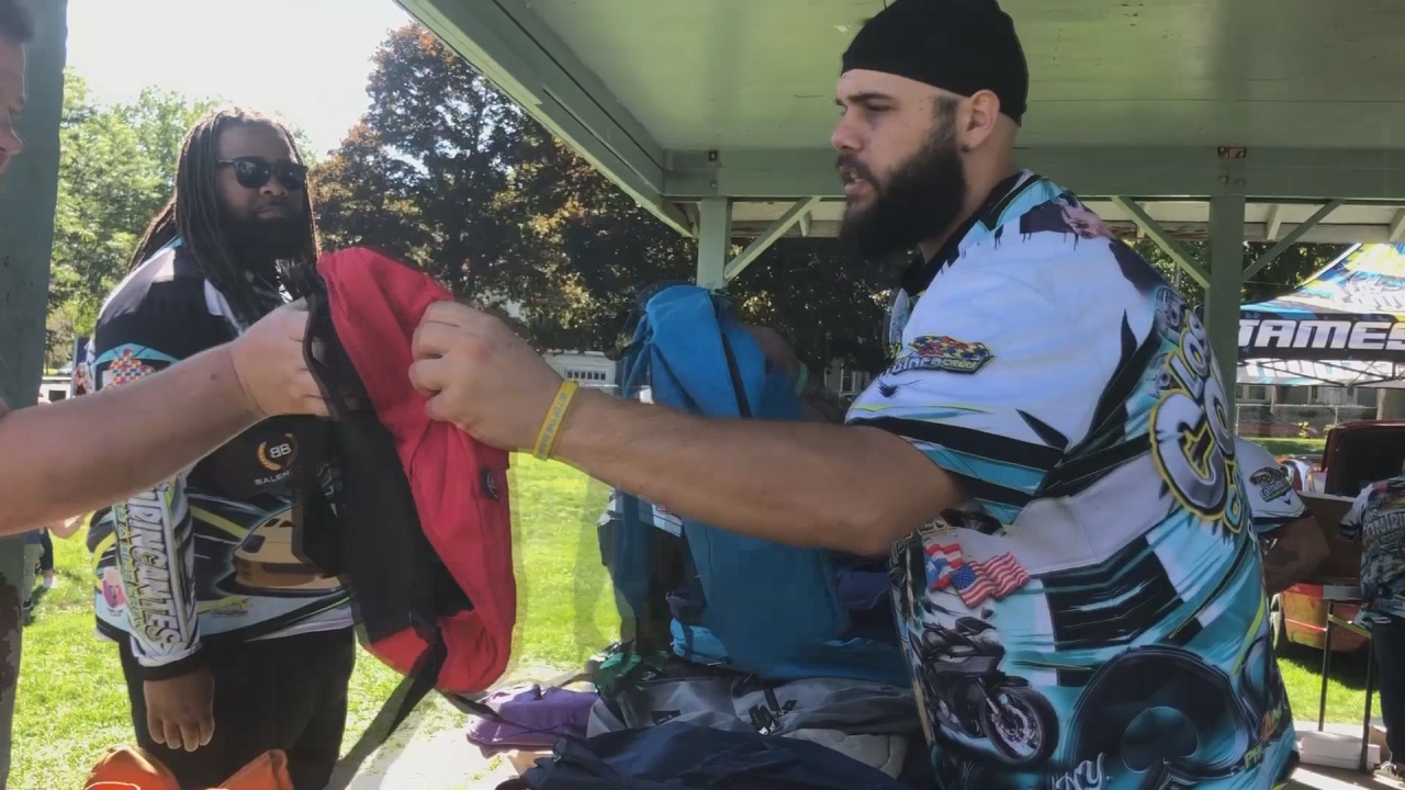 Los Contrincantes Car Club Hosts Backpack Giveaway In Jamestown