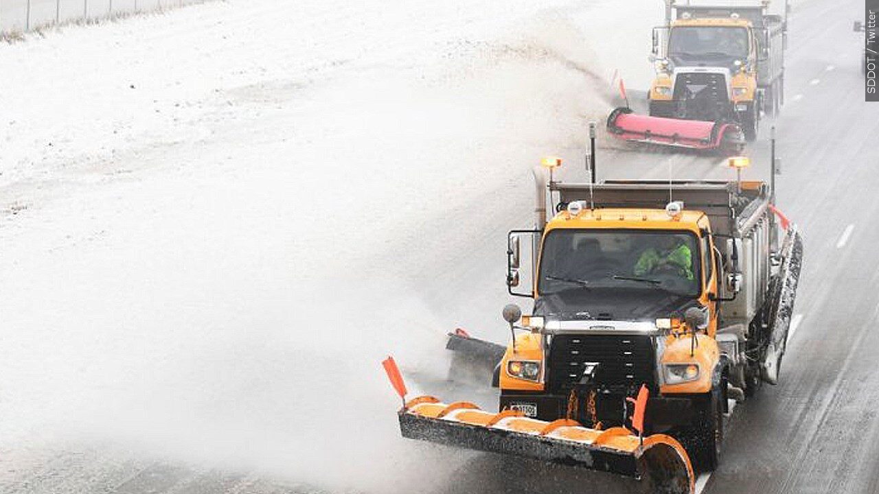 Snow plows clearing snow